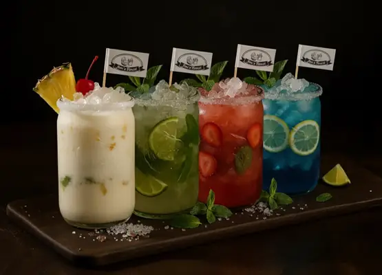 Cocktails: Piña Colada, Mojito, Daiquiri, Blue Lagoon